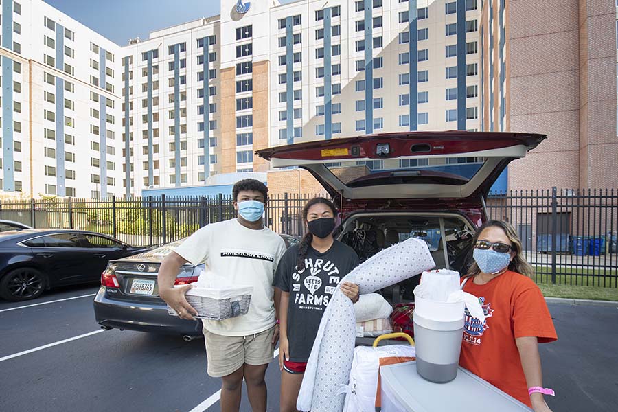 Sheryl Watts (center), an incoming freshman education major at Georgia State, gets some help from her family as she moves into Piedmont Central