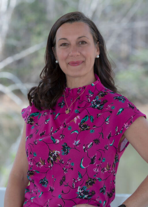 Woman in floral blouse with brown hair