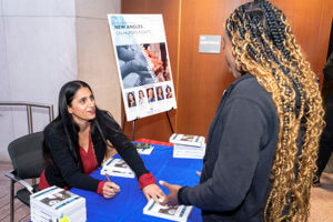 Dr. Mona Hanna talking with a student