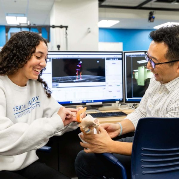 a teacher an student examine a model of an ACL