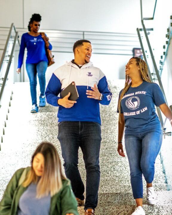 DeChino Duke (J.D. '23) chats with his friends between classes.