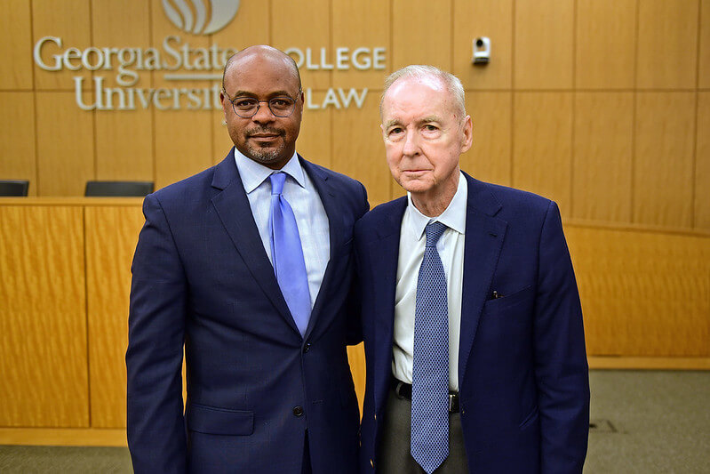 Ben F. Johnson III,retired managing partner of Alston & Bird and son of the award's namesake, congratulates Justice Melton on being the 2026 recipient.