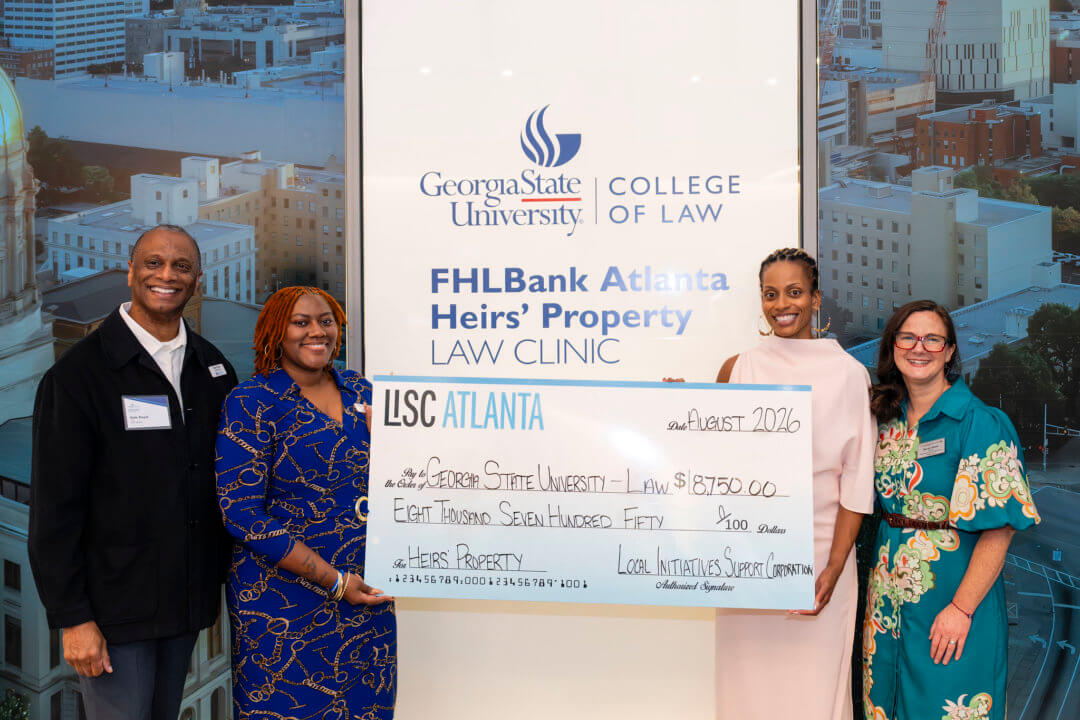 Representatives from Local Initiatives Support Corporation (LISC) Atlanta present the FHLBank Atlanta Heirs' Property Law Clinic with a gift in support of the clinic's work.