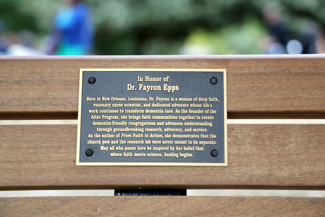 Close-up of the plaque on the Piedmont Park storytelling bench honoring Fayron Epps.