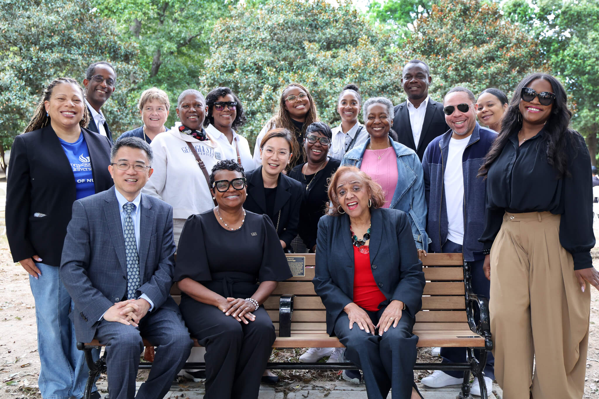 Lewis College faculty gather with Dr. Epps to honor her bench dedication in Piedmont Park.