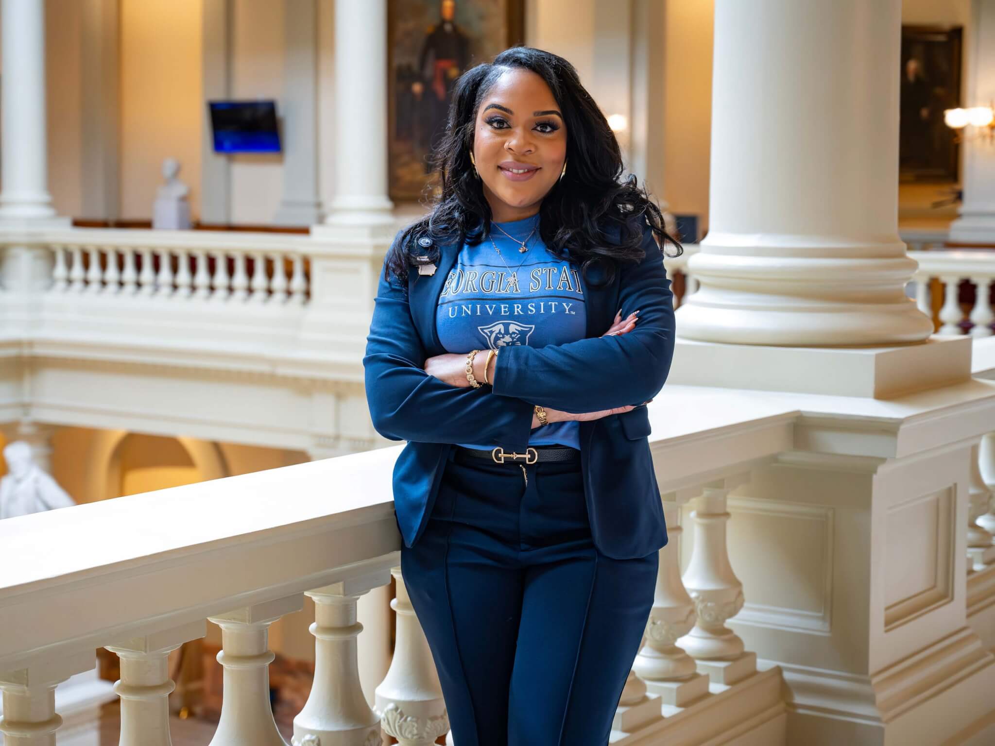 Brenda Washington, a nontraditional student at Georgia State, stands in a professional blazer at the Georgia Capitol during her legislative internship.