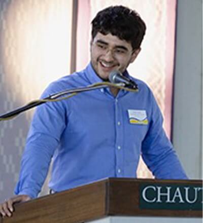 Daniel Erazo at a podium.