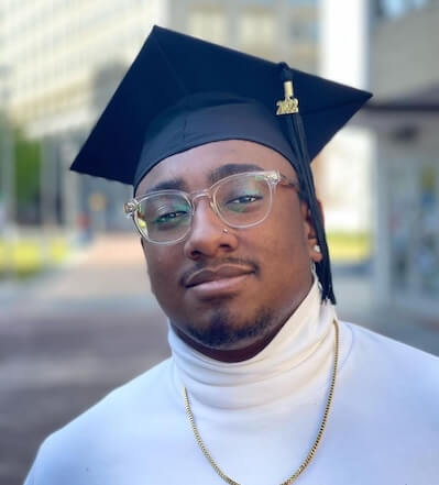 Graduation headshot of Mickeal Cadore.