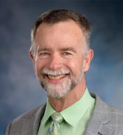 Portrait photo of Greg Lewis