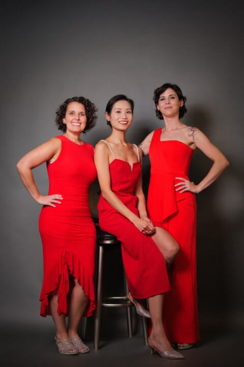 Hera Trio in red dresses