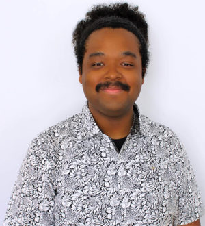 Headshot of Naj Hughey.
