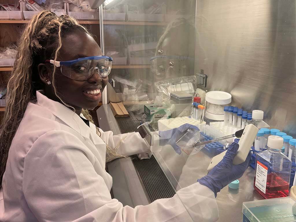 Rachel Ninson working in a research lab.