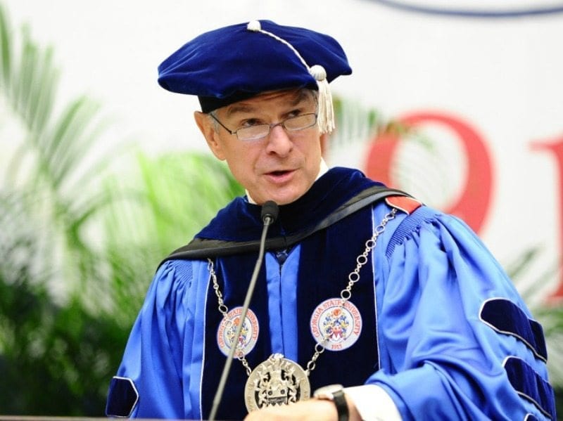 President Mark Becker giving a speech at Convocation