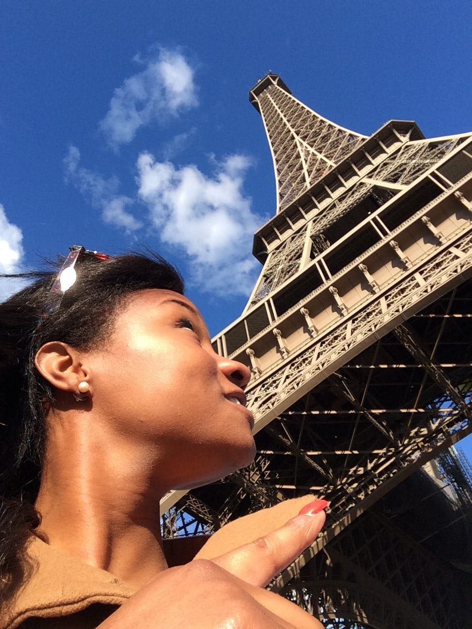 Coco posing with the Eiffel Tower