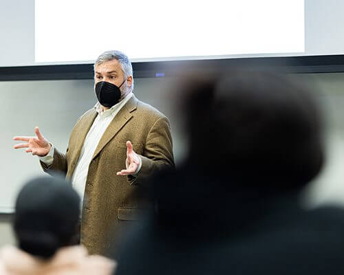 This is a photo of Dr. Weeks teaching in his classroom.