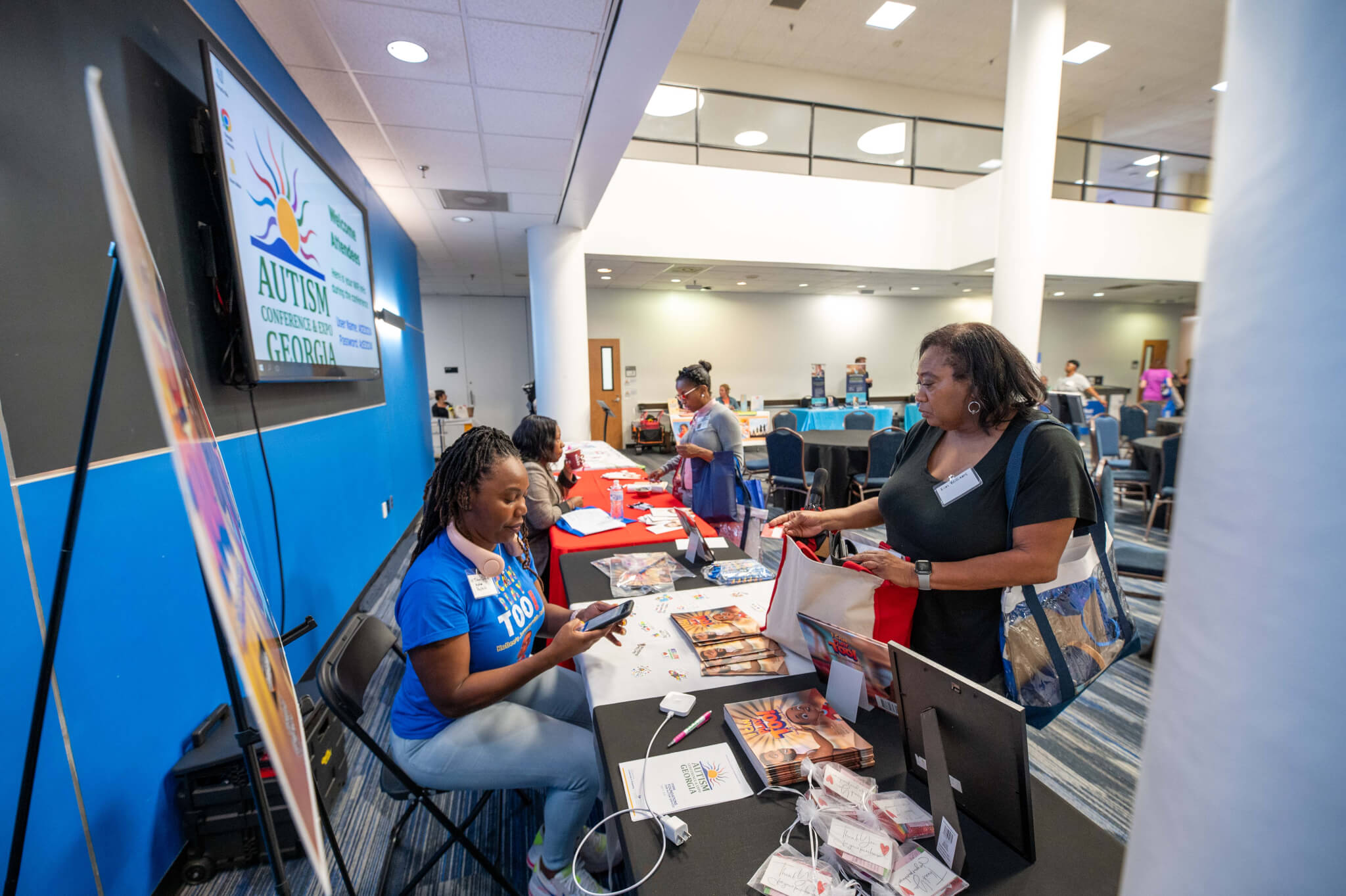 Black female attendee and Black female exhibitor
