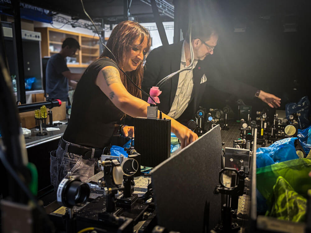student and researcher working in a lab