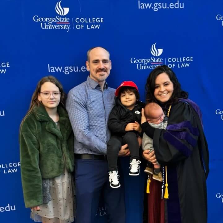 Ruth Muñoz Orellana celebrates at Georgia State Law Commencement with her family.