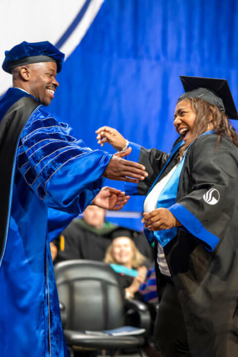 Man and woman in cap and gown