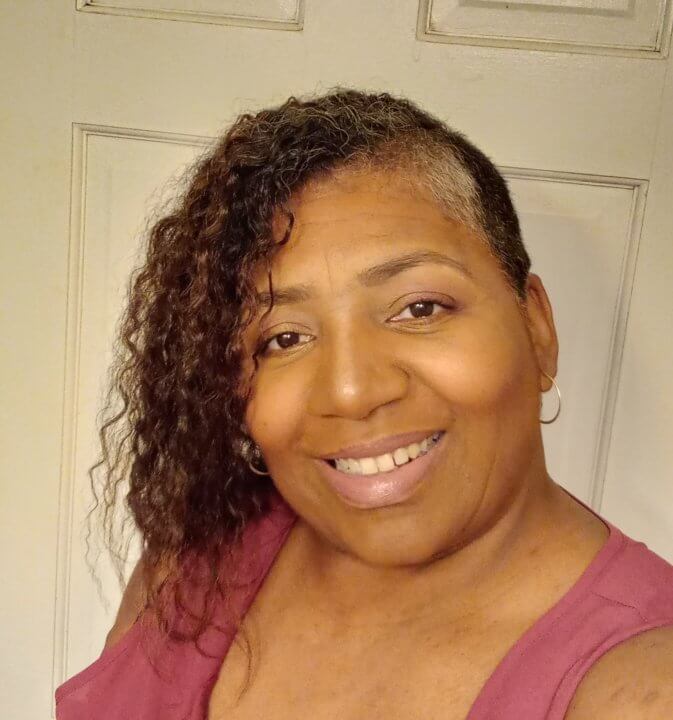 Smiling woman wearing pink shirt