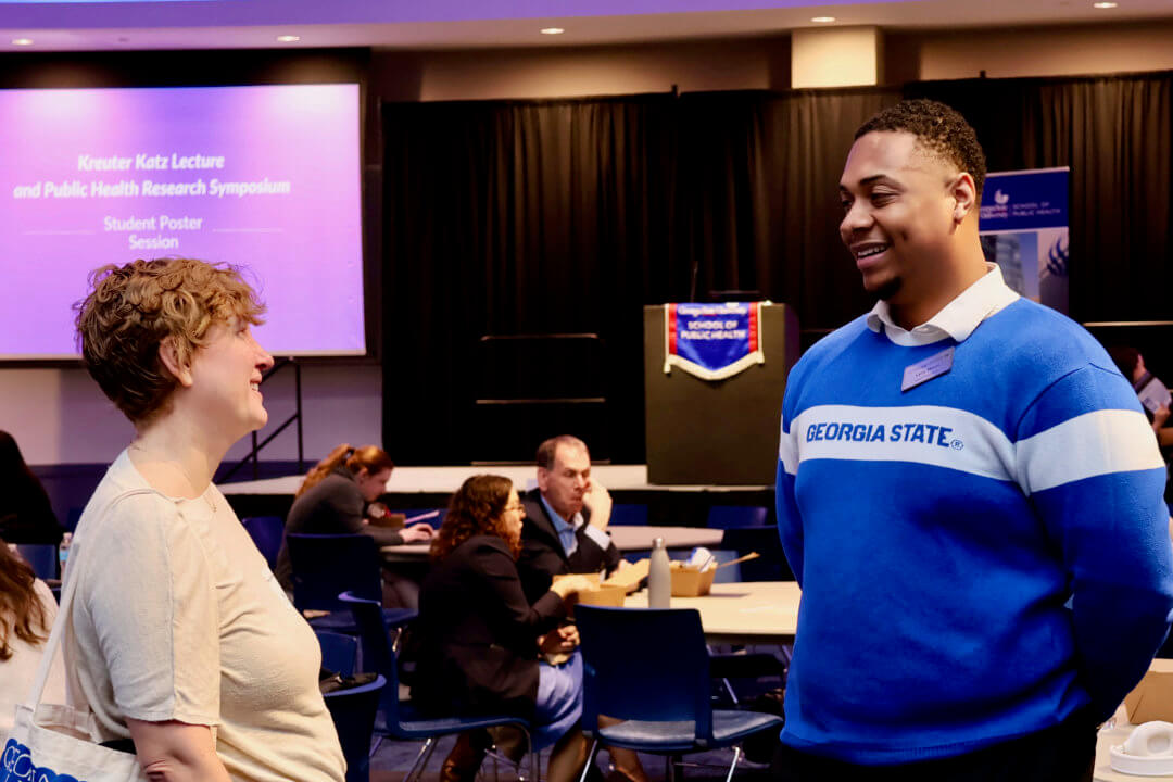 young black man speaking to a white woman