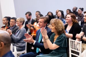 Crowd applauding at event