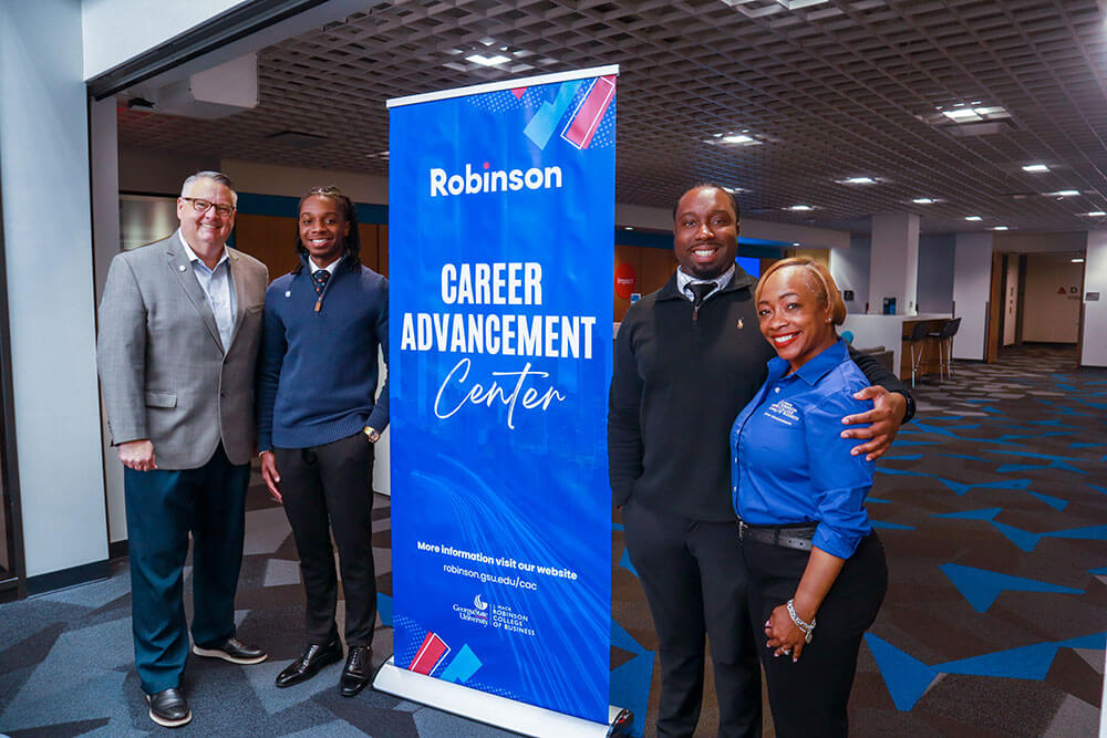 from left to right: Jason Aldrich, associate dean for strategic partnerships and career advancement; Joey Pitaud; Chris Berlus; and La'Kesha Hughes, associate director of undergraduate career advancement
