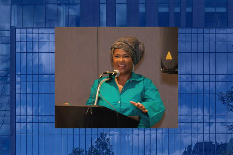 Tanya Washington speaks at a podium - Rights4Children