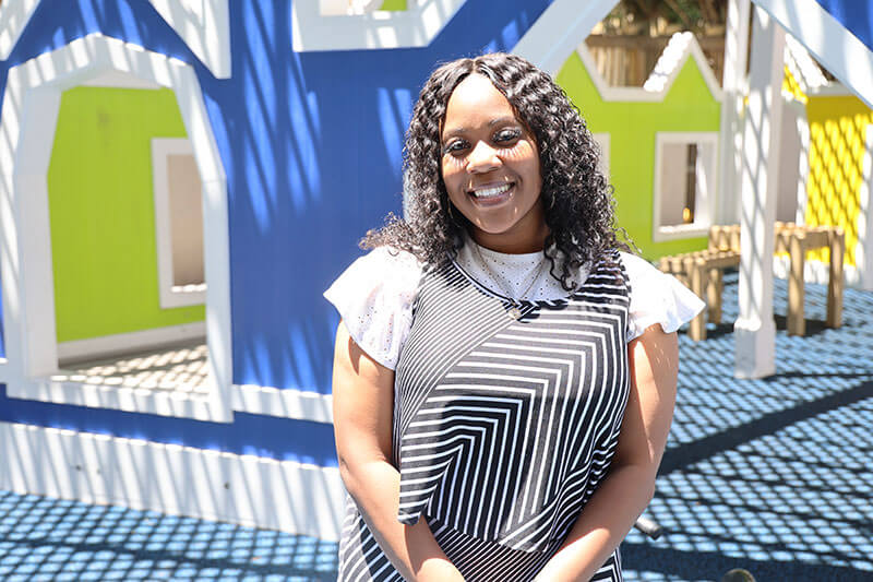 Zequoia Westmoreland poses for a photo on the playground at the Lanette L. Suttles Child Development Center