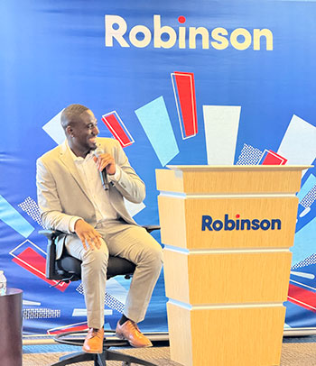 M.S.A. in Data Science & Analytics alumnus Xavier Alleyne speaks at a Robinson event.