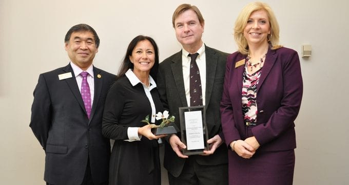Shinji Morokuma (J.D.’98) (from left) and Bonnie Powell (J.D.’98) present the 2016 Chief Justice Harold C. Clarke Award to Professor Doug Yarn. Tracy Johnson (right) is also pictured.