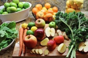 shot of fresh fruits and vegetables ready to juice
